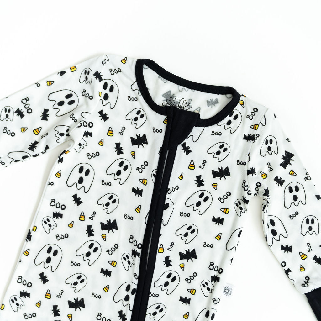 Children's onesie with Halloween-themed pattern on a white background