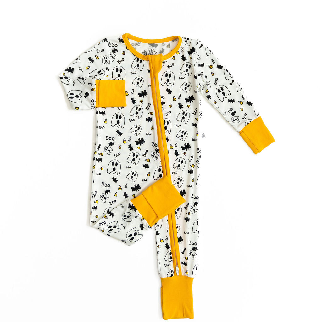 Baby onesie with Halloween-themed print and yellow accents on a white background