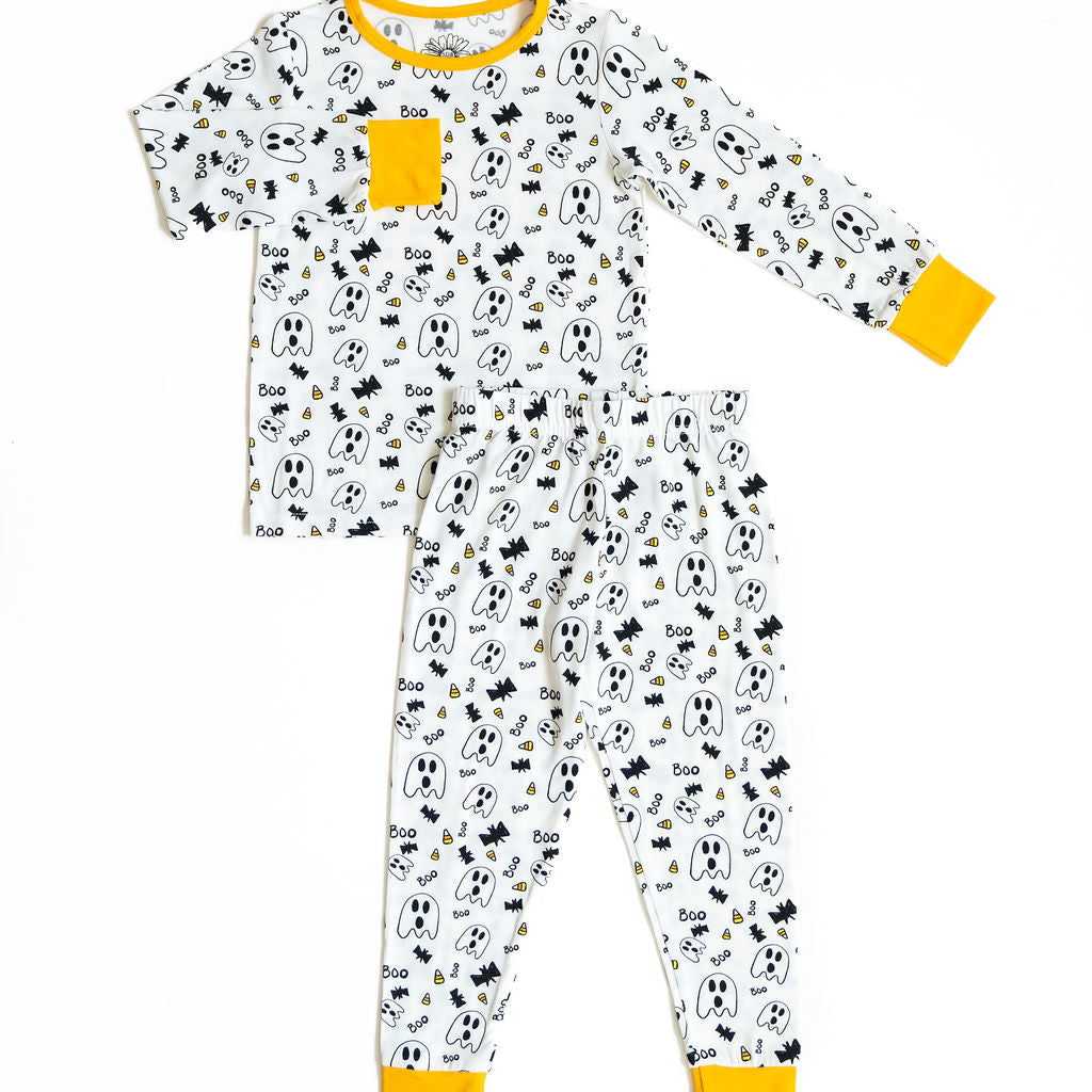 Children's pajama set with ghost and moon pattern on a white background
