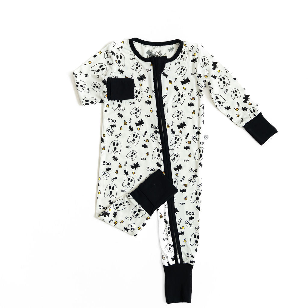 Baby onesie with black and white pattern on a white background
